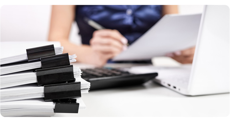 A Bookkeeper cleaning up a business' books