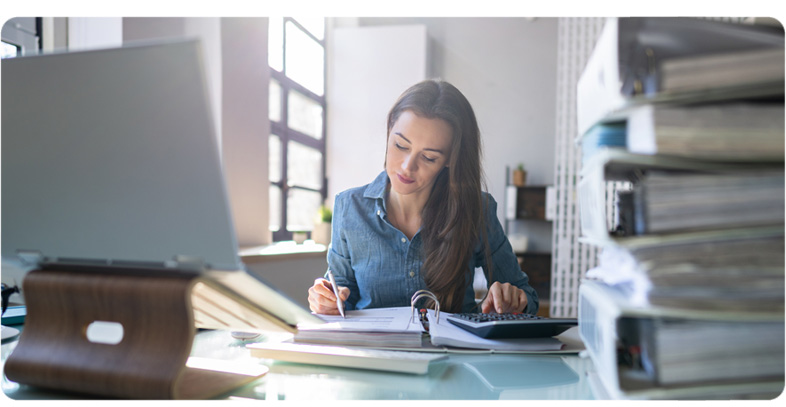 A Professional Bookkeeper working at a private business on their books
